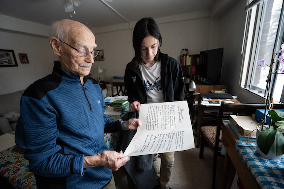 Ravin and Do read a thank-you note written in Russian that Ravin, a former physics professor, received from his students in Belarus for his 50th birthday.