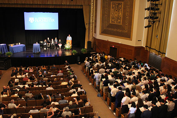 Students recite stand to recite an oath in Strong Auditorium during the Order of the Engineer ceremony.