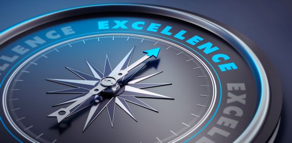 Image of a compass that points north to excellence.