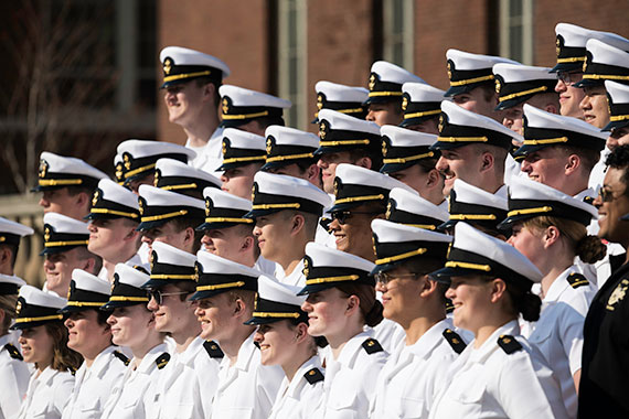 A group of dozens of NROTC midshipmen in uniform.