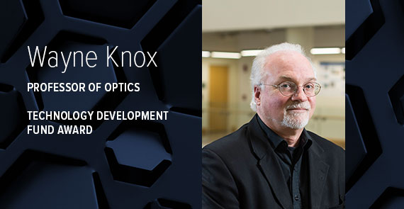 A graphic with blue hexagonal shapes, a headshot, and text that says "Wayne Knox, Professor of Optics, Technology Development Fund Award."