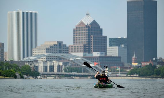 Katherine “Katie” Gregory, a PhD candidate in the Department of Earth and Environmental Sciences, in a kayak on the Genesee River.