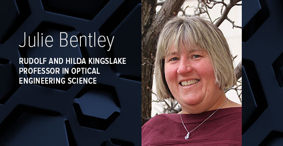 A graphic with dark blue hexagonal shapes, a headshot, and text that says "Julie Bentley, Rudolf and Hilda Kingslake Professor in Optical Engineering Science."