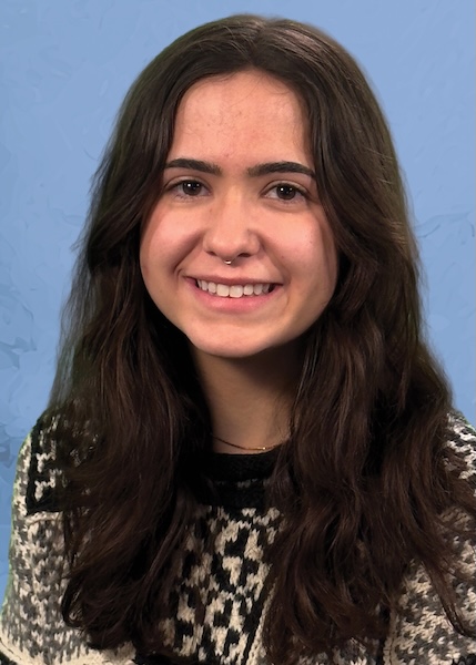 Headshot of smiling woman with long brown hair.
