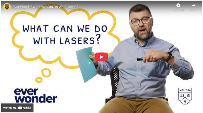 Screenshot of a YouTube page. A man in glasses holds a laser pointer. A thought bubble reads: What can we do with lasers?