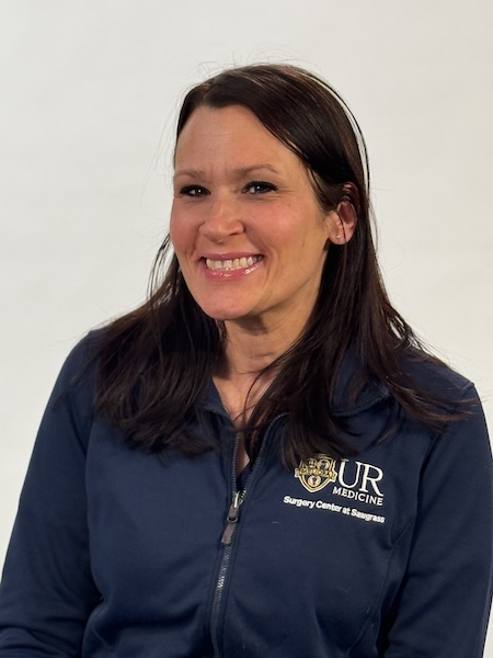 Headshot of smiling woman in a navy UR Medicine jacket.