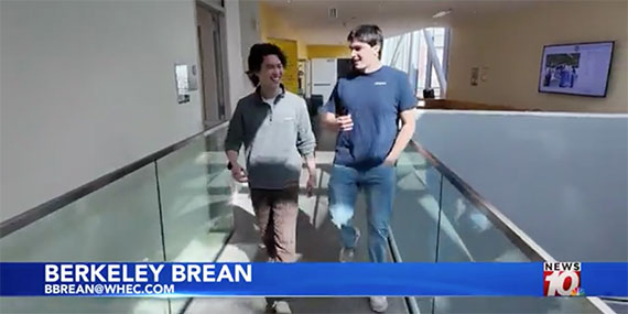 Steve Lim and Walter McDonald walk down the hallway of Wegmans Hall.