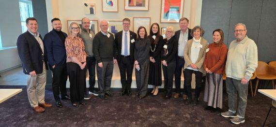 Photo of Dean Sam Thomas with 12 members of the SAS National Council.