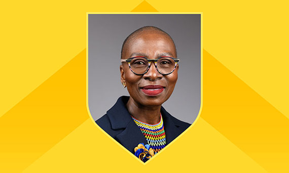 A graphic featuring a headshot of Reitumetse Mabokela on a shield against a bright yellow background.