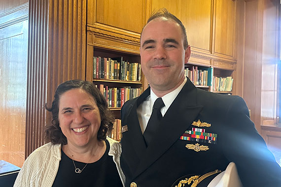 Wendi Heinzelman and Commander Robert Augustine in the Rush Rhees Library.