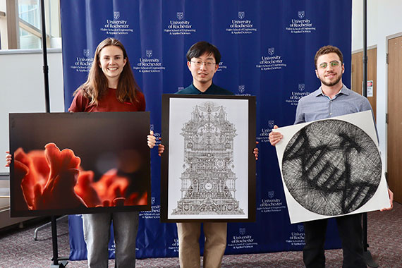 Meg Farinsky, Matthew Ahn, and Majd Tabsi hold up their award-winning pieces of art.