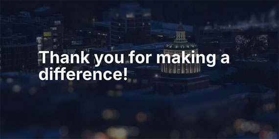 Text that says "Thank you for making a difference" overlaid on a nighttime aerial view of the University of Rochester campus.