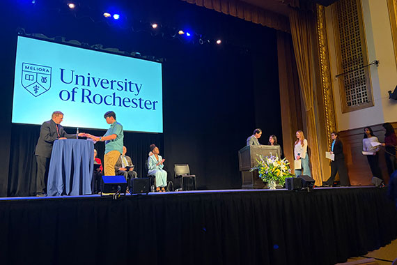 Students and faculty on stage during as rings are presented during the Order of the Engineer Ceremony.