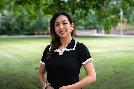 A medium shot of Sylvia Tiballi on the Eastman Quadrangle.