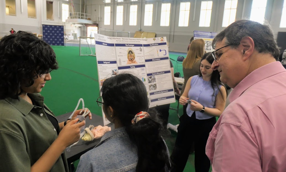 Biomedical engineering students demonstrate their project during Design Day.