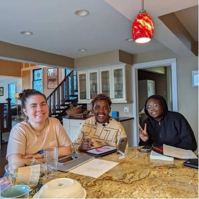 Three people sitting around a table..jpg