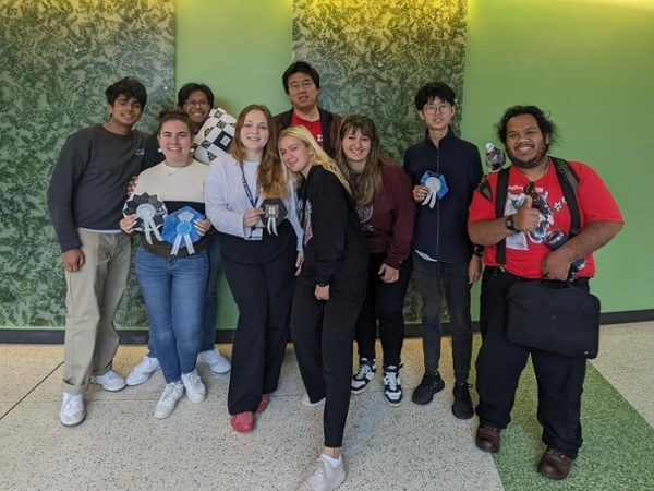 A group of debaters pose for the camera.