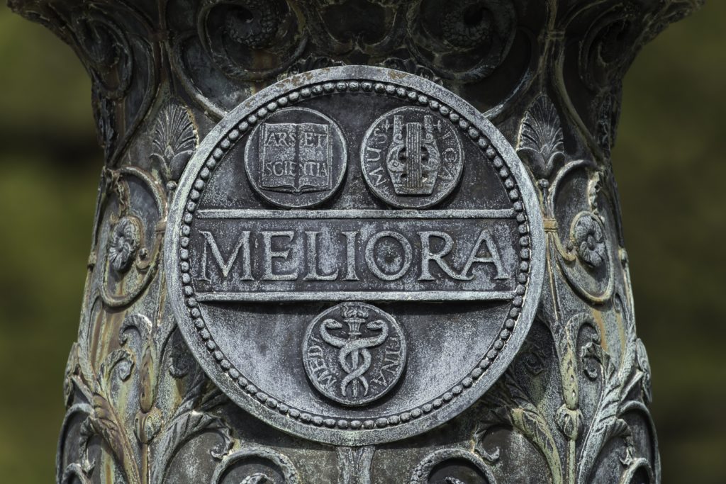 The Meliora seal on the University flagpole