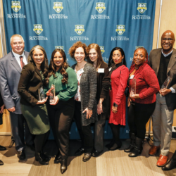 President Magelsdorf and Dr Adrienne Morgan pose with the 2024 Presidential Stronger As One Diversity Award winners during the reception in Feldman Ballroom January 25, 2024. // photo by Matt Wittmeyer for the University of Rochester