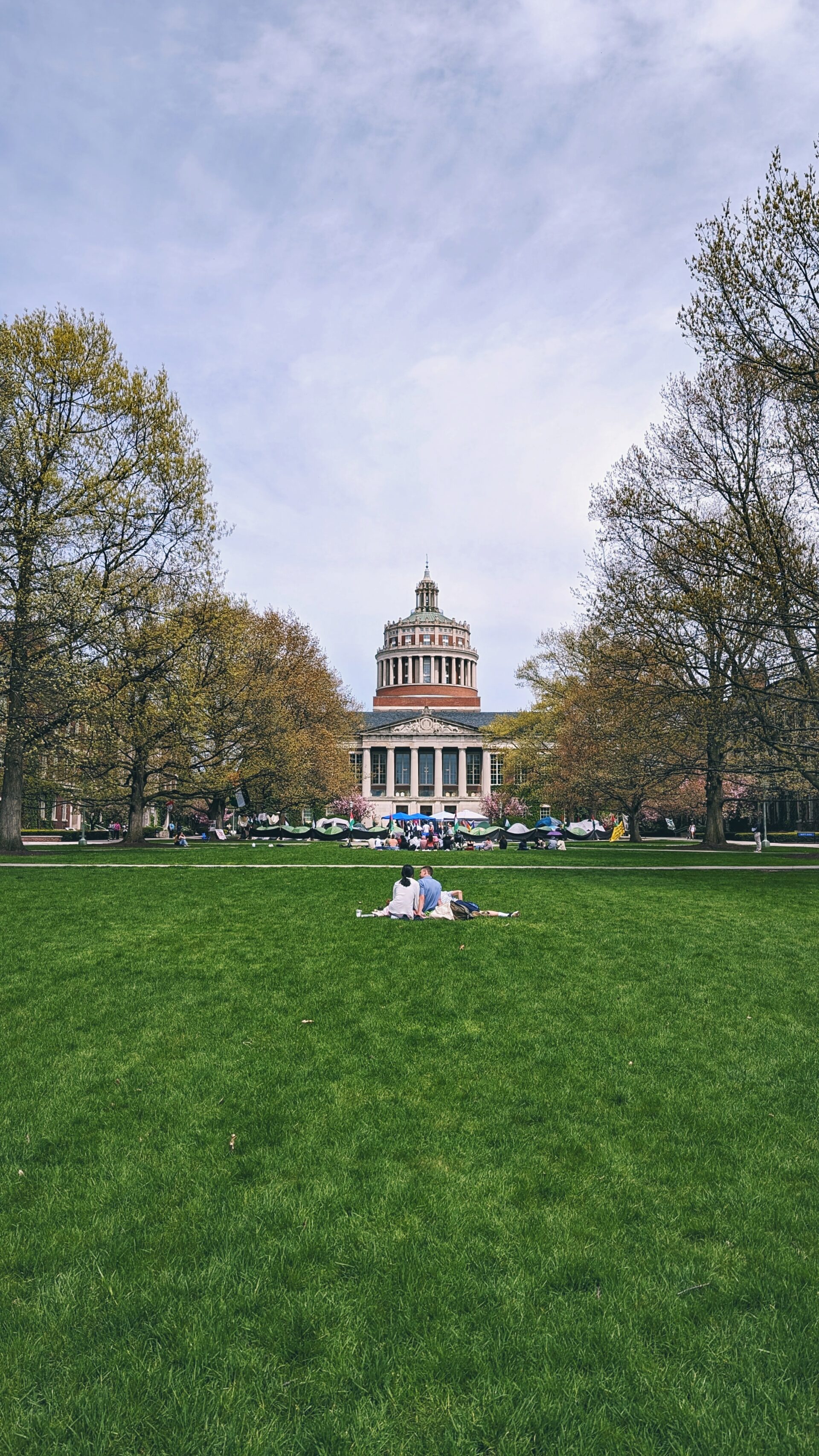 Two students studying on the Eastman Quad