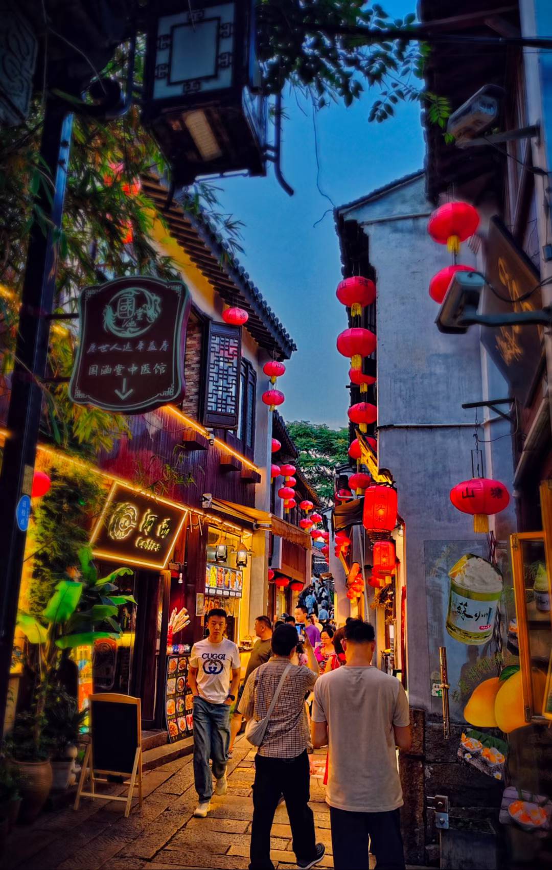 A small Chinese town street lit up at night
