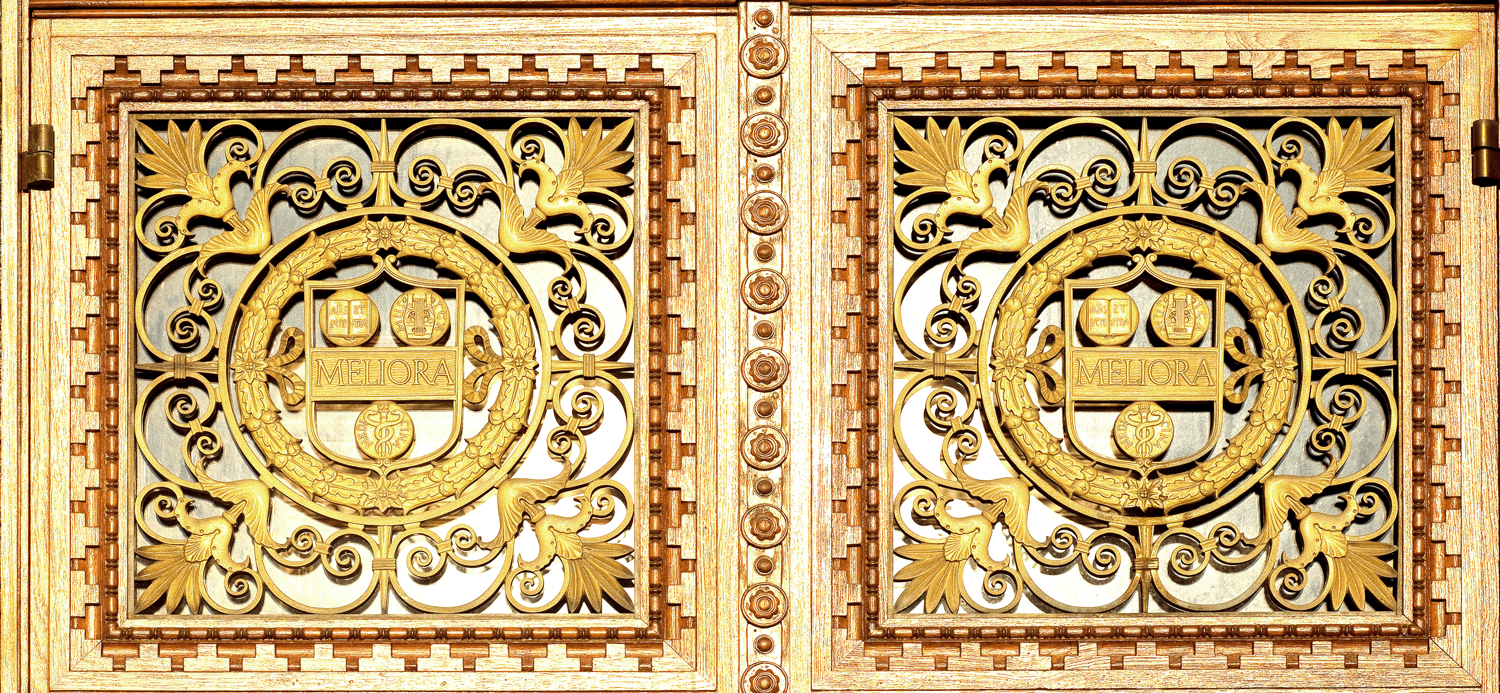 Ornate golden decorations featuring intricate designs, showcasing elegance and craftsmanship in a stunning architectural detail.