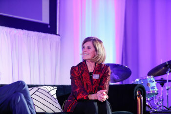 A candid photo of a female speaker at the George Eastman Circle Annual Member Dinner.