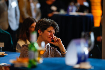 An attendee listens attentively during a speech at the George Eastman Circle Faculty & Staff Reception in Rochester, NY.