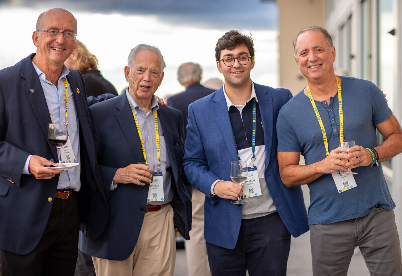 4 guys smiling and posing for the camera