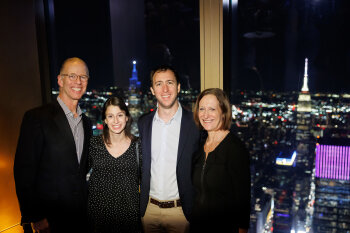 4 people posing for photo