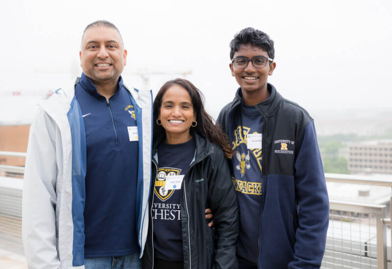 A family of three pose for a photo at the George Eastman Circle Family Celebration, held April 30, 2023, within Washington, DC.