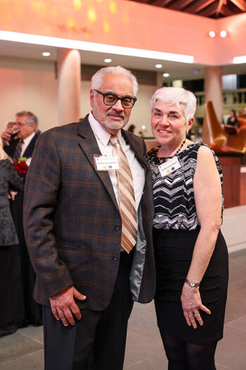 A man and woman pose for a photo