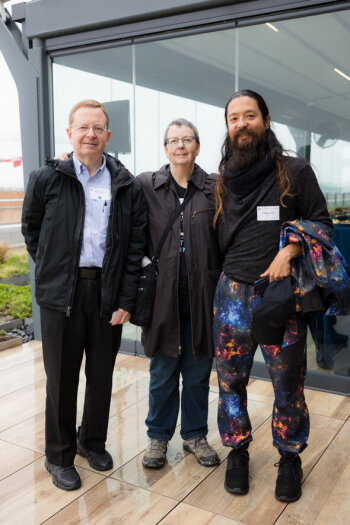 Two men and a women pose for a photo at the George Eastman Circle Family Celebration, held April 30, 2023, within Washington, DC.