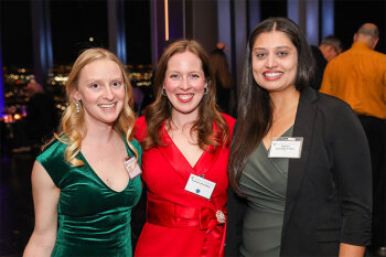 Group posing for photo at reception event