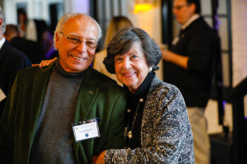 A couple smiles warmly for the camera at the 2025 George Eastman Circle Faculty & Staff Reception.