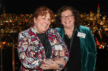 two women posing for photo