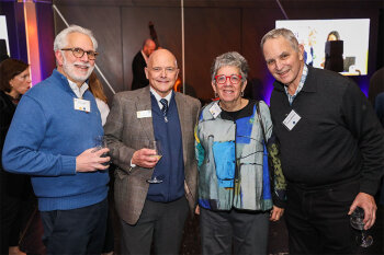 Group posing for photo at reception event
