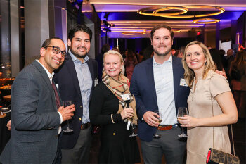 Group posing for photo at reception event
