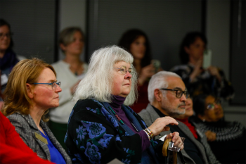 An audience listening to a speech