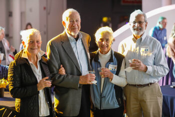 Two couples pose for a photo at the George Eastman Circle Family Celebration, held on April 27, 2023 within Rochester New York.