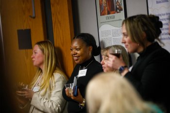A group of people watching a presentation