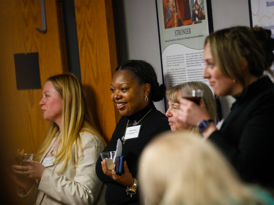 A group of people watching a presentation