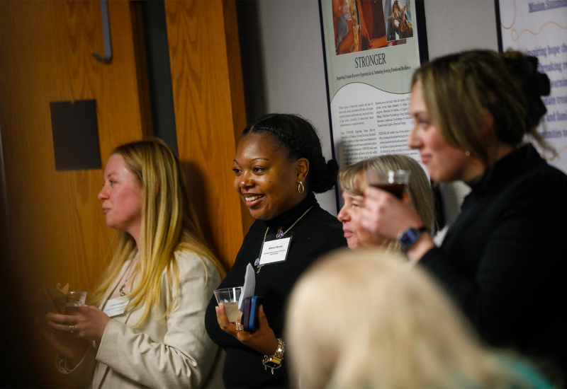 A group of people watching a presentation