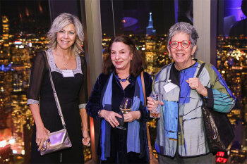 Group posing for photo at reception event