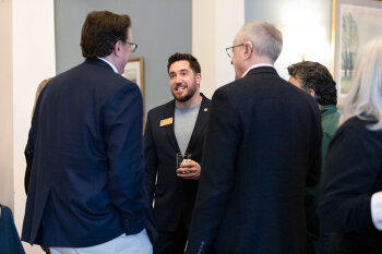 A group of individuals talking.