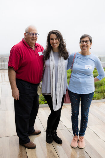 A family of three pose for a photo at the George Eastman Circle Family Celebration, held April 30, 2023, within Washington, DC.