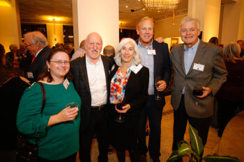 A group of attendees pose for a photo at the George Eastman Circle Annual Member Dinner.