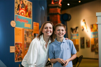 A woman and boy posing for camera