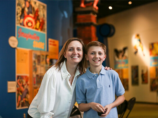 A woman and boy posing for camera