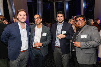 Group posing for photo at reception event